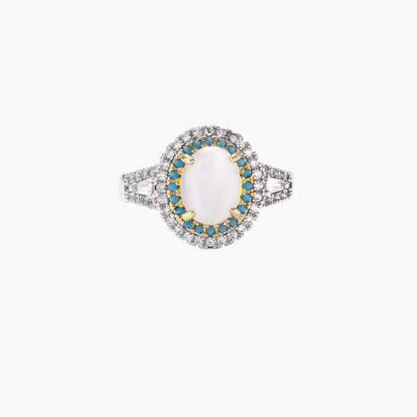 Vintage-style cocktail ring with luminous cat's eye center stone surrounded by turquoise and crystal double halo on white gold plated band