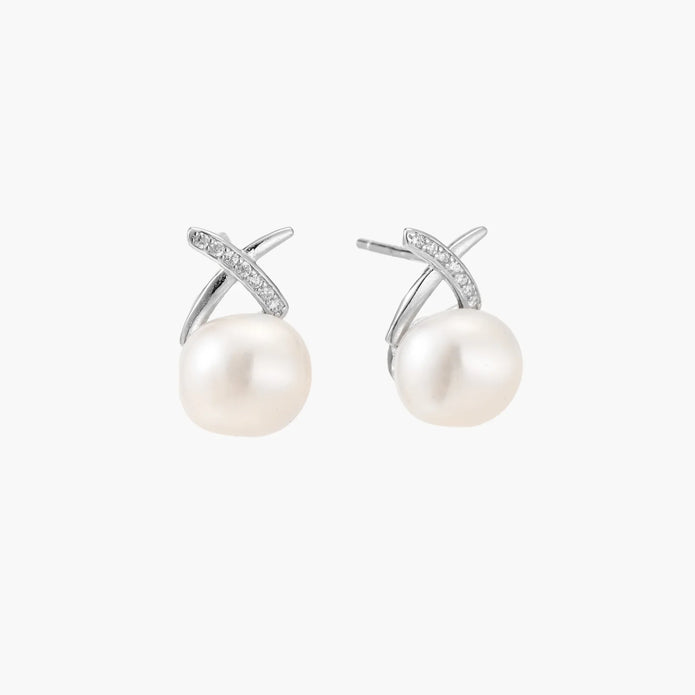 Rhodium-plated silver stud earrings with sparkling X design above lustrous round freshwater pearls on white background.