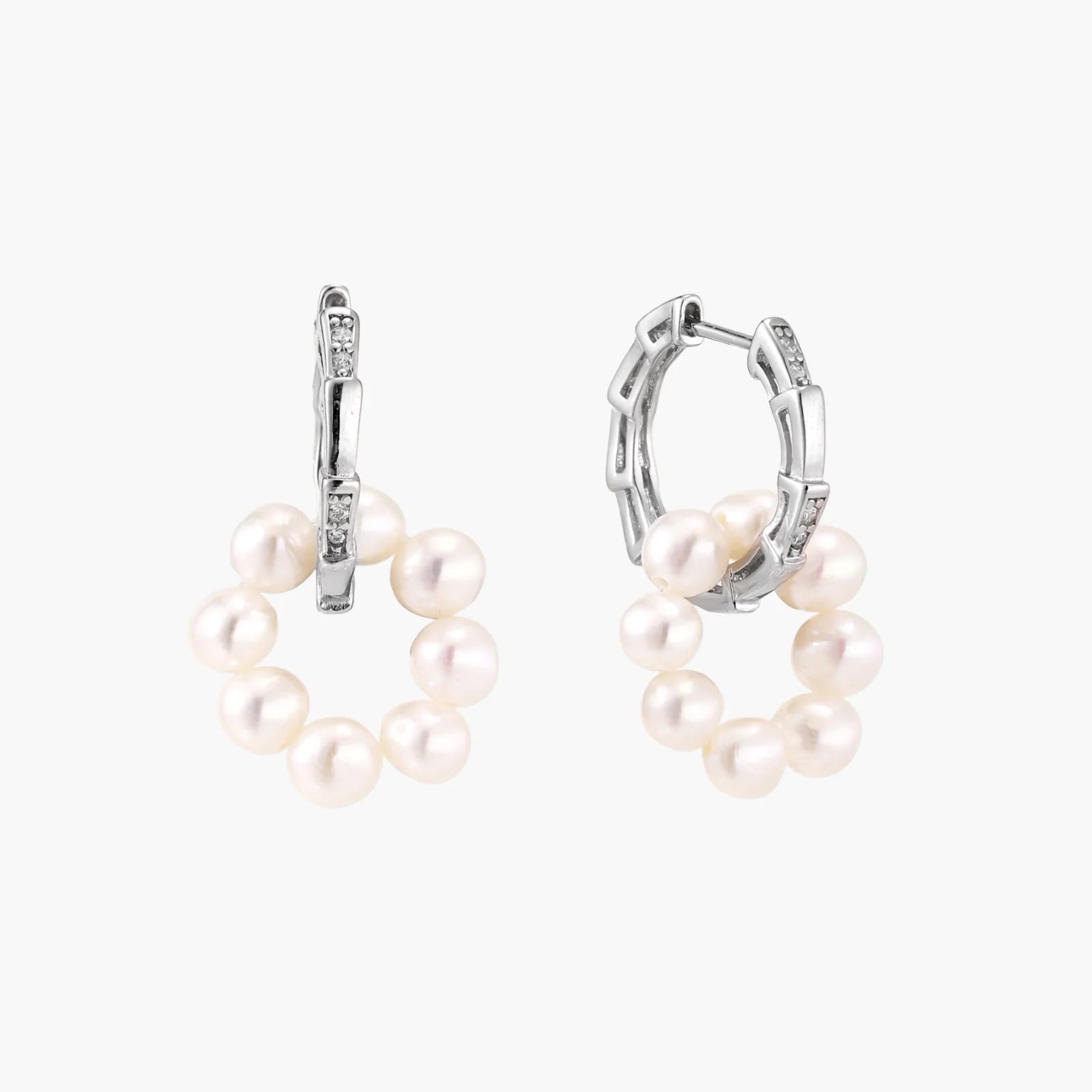 Rhodium-plated silver hoop earrings with freshwater pearls arranged in crescent formation and diamond accents