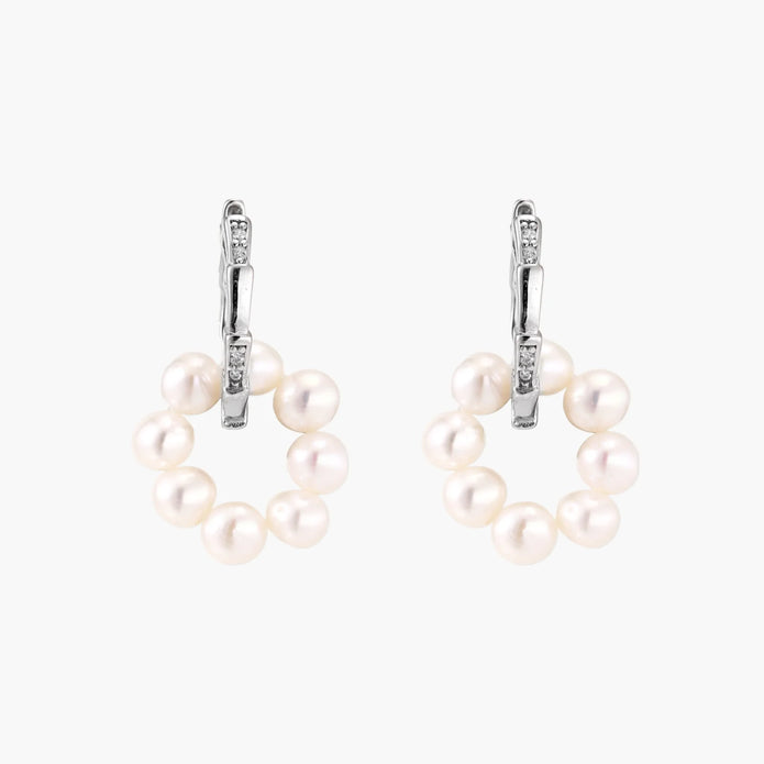 Rhodium-plated silver hoop earrings with freshwater pearls arranged in crescent formation and diamond accents