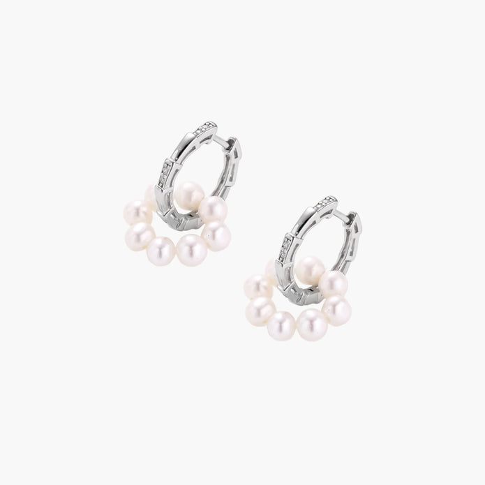 Rhodium-plated silver hoop earrings with freshwater pearls arranged in crescent formation and diamond accents