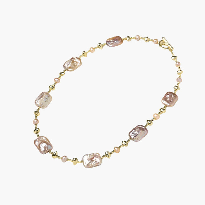 Iridescent baroque pearls alternating with small freshwater pearls on 14K gold-plated chain