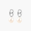 Modern rhodium-plated silver earrings with geometric double-circle design and freshwater pearl drops