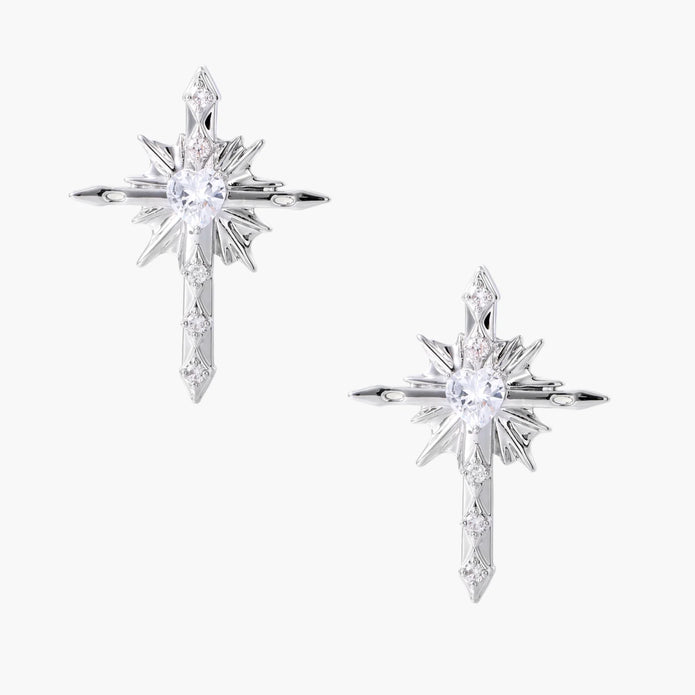 Silver starburst earrings with radiating points and dagger drop design featuring clear zirconia stones