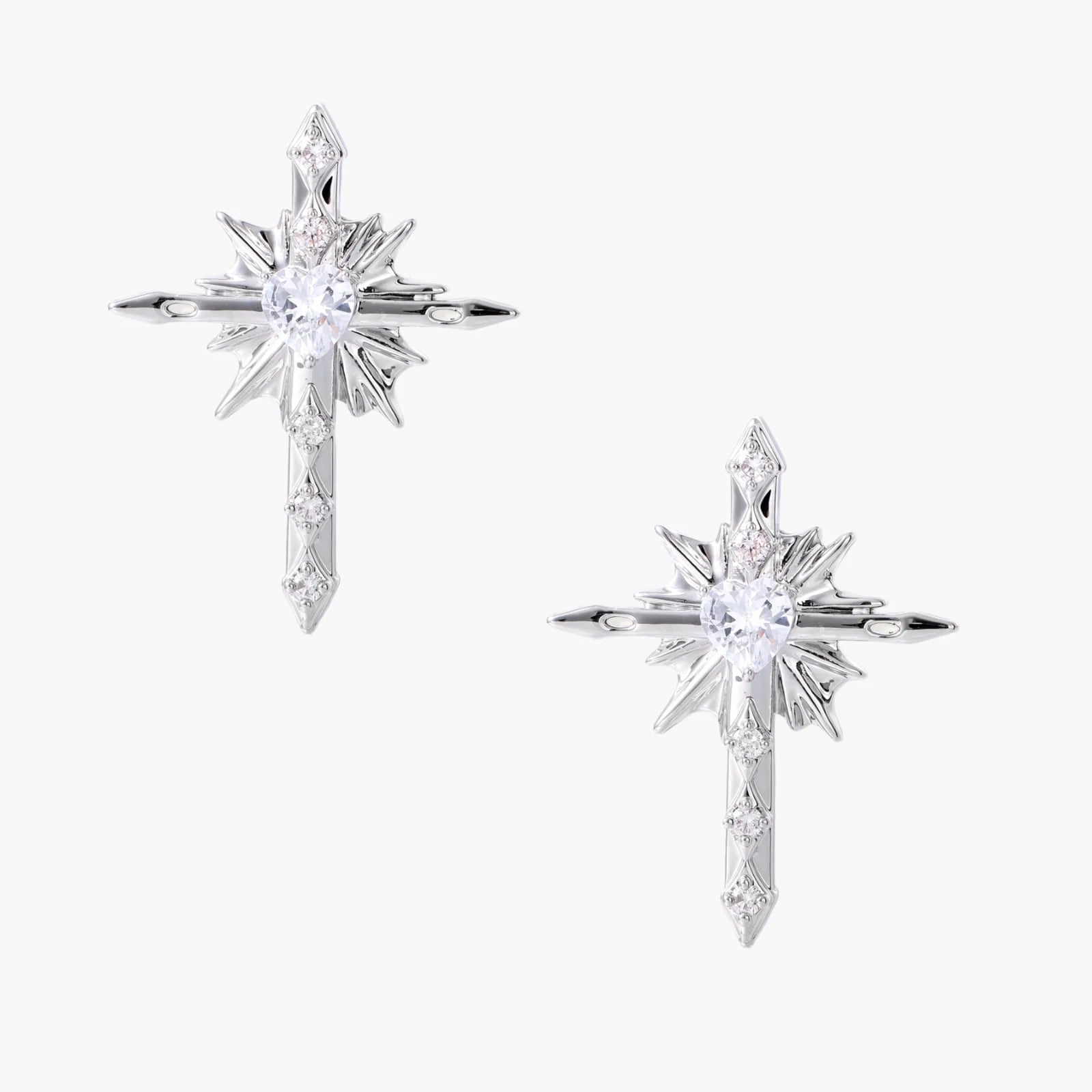 Silver starburst earrings with radiating points and dagger drop design featuring clear zirconia stones
