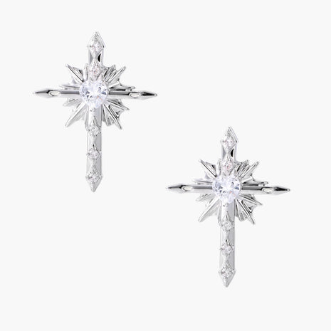 Silver starburst earrings with radiating points and dagger drop design featuring clear zirconia stones