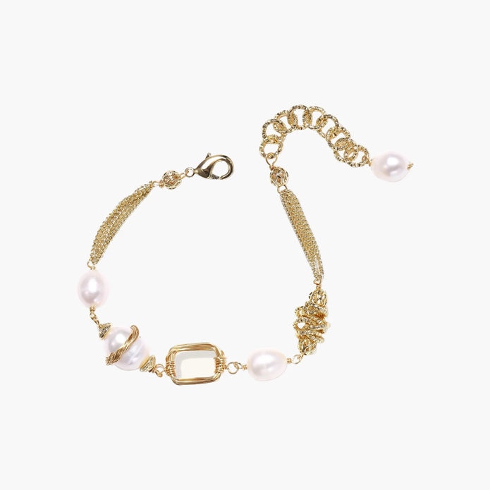 14K gold plated bracelet with freshwater pearls, filigree details, and mixed geometric elements on white background.