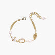 14K gold plated bracelet with freshwater pearls, filigree details, and mixed geometric elements on white background.