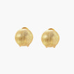 Pair of brushed gold dome earrings with clip backs showing textured matte finish on cream background