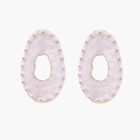 Oval lavender enamel earrings with marbled finish and gold-plated beaded border on cream background.