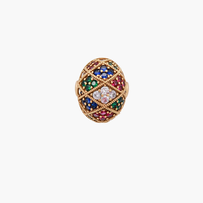 Oversized gold ring with geometric mosaic pattern featuring multicolor zirconia stones in ruby, emerald, sapphire, and clear tones.