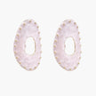 Oval lavender enamel earrings with marbled finish and gold-plated beaded border on cream background.