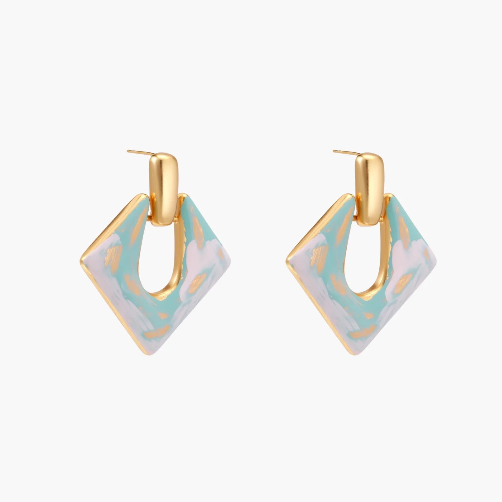 Geometric square enamel earrings with marbled turquoise and lavender pattern, gold U-shaped connector on cream background.
