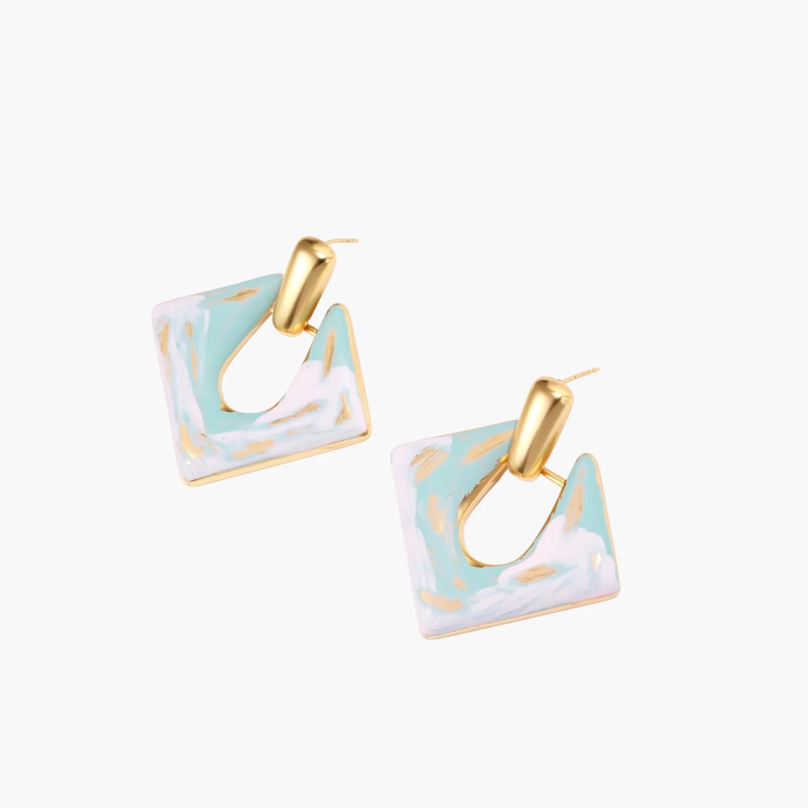 Geometric square enamel earrings with marbled turquoise and lavender pattern, gold U-shaped connector on cream background.