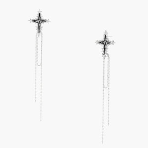 Long silver threader earrings with ornate cross-star design and delicate dual chain tassels on white background