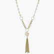 Long gold-plated necklace with freshwater pearls, chunky chain links, and flowing tassel pendant