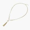 Long gold-plated necklace with freshwater pearls, chunky chain links, and flowing tassel pendant