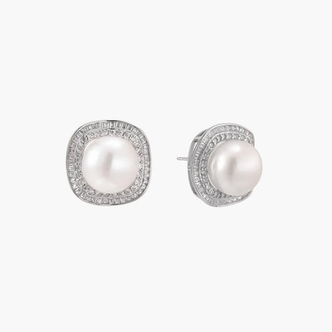 Cushion-shaped sterling silver stud earrings with freshwater pearls surrounded by geometric diamond halos