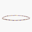 Delicate 18K gold vermeil necklace with alternating lavender zirconia beads and white freshwater pearls on cream background