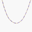 Delicate 18K gold vermeil necklace with alternating lavender zirconia beads and white freshwater pearls on cream background