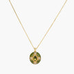 Gold-plated pendant necklace with green enamel background and oval olive cubic zirconia center stone with crystal accents.