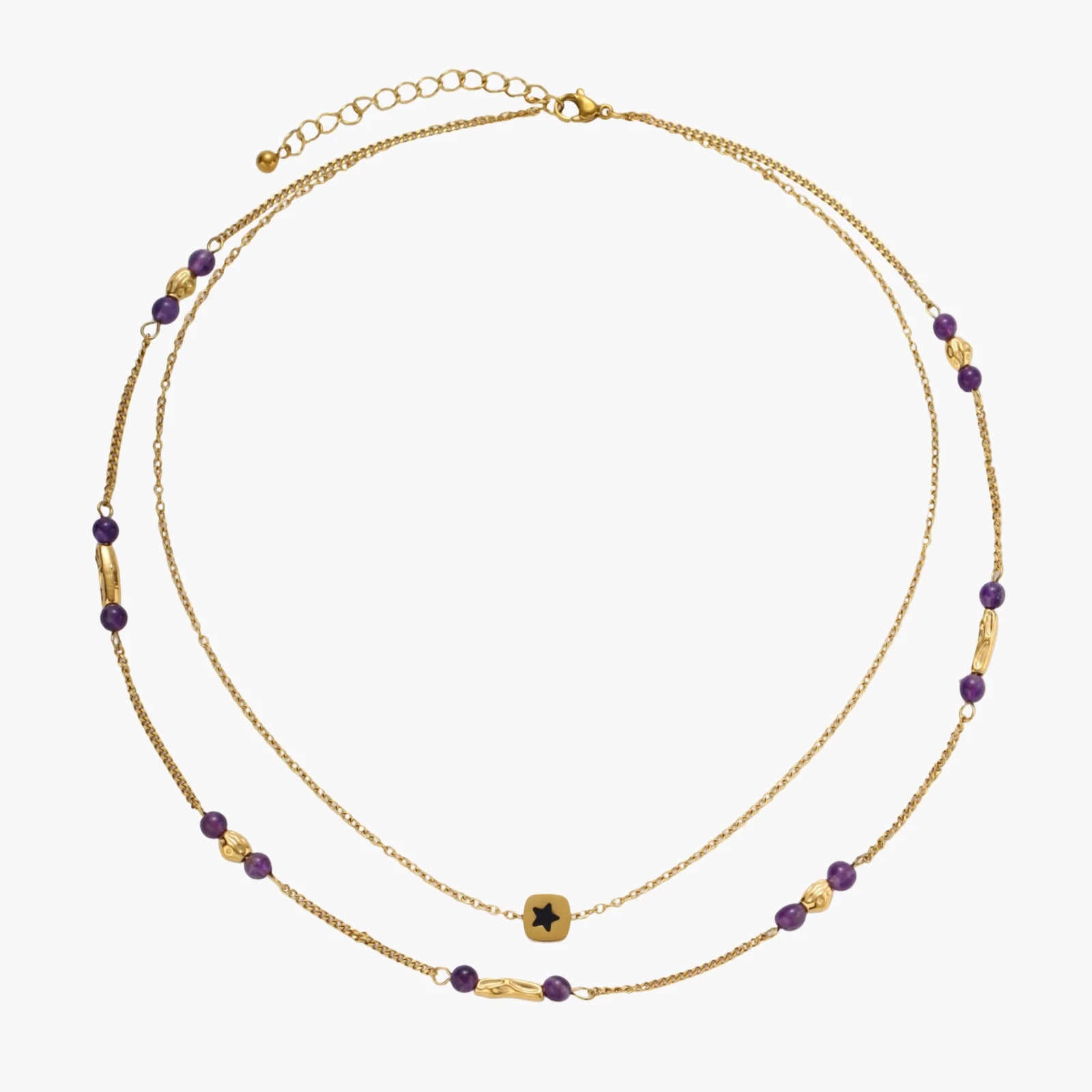 Two layered gold-tone necklaces with purple stone beads and star pendant against cream background.