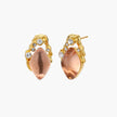Gold-plated baroque stud earrings with coral-pink liuli stones and cubic zirconia crystals on white background.