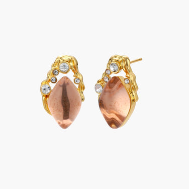 Gold-plated baroque stud earrings with coral-pink liuli stones and cubic zirconia crystals on white background.