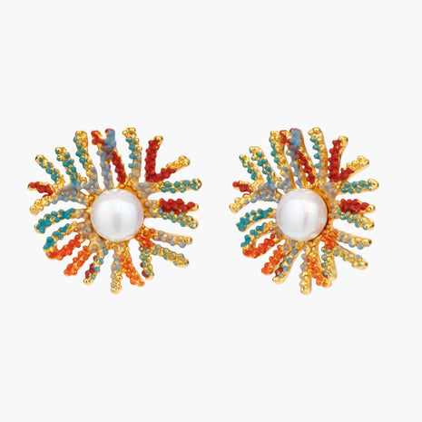Vibrant starburst stud earrings with multicolor enamel rays and white pearl centers on gold-plated setting