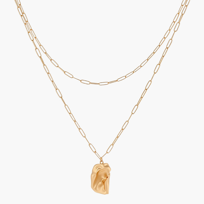 Layered paperclip chain necklace with organic flowing pendant made from eco-zinc alloy in warm gold finish