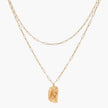 Layered paperclip chain necklace with organic flowing pendant made from eco-zinc alloy in warm gold finish