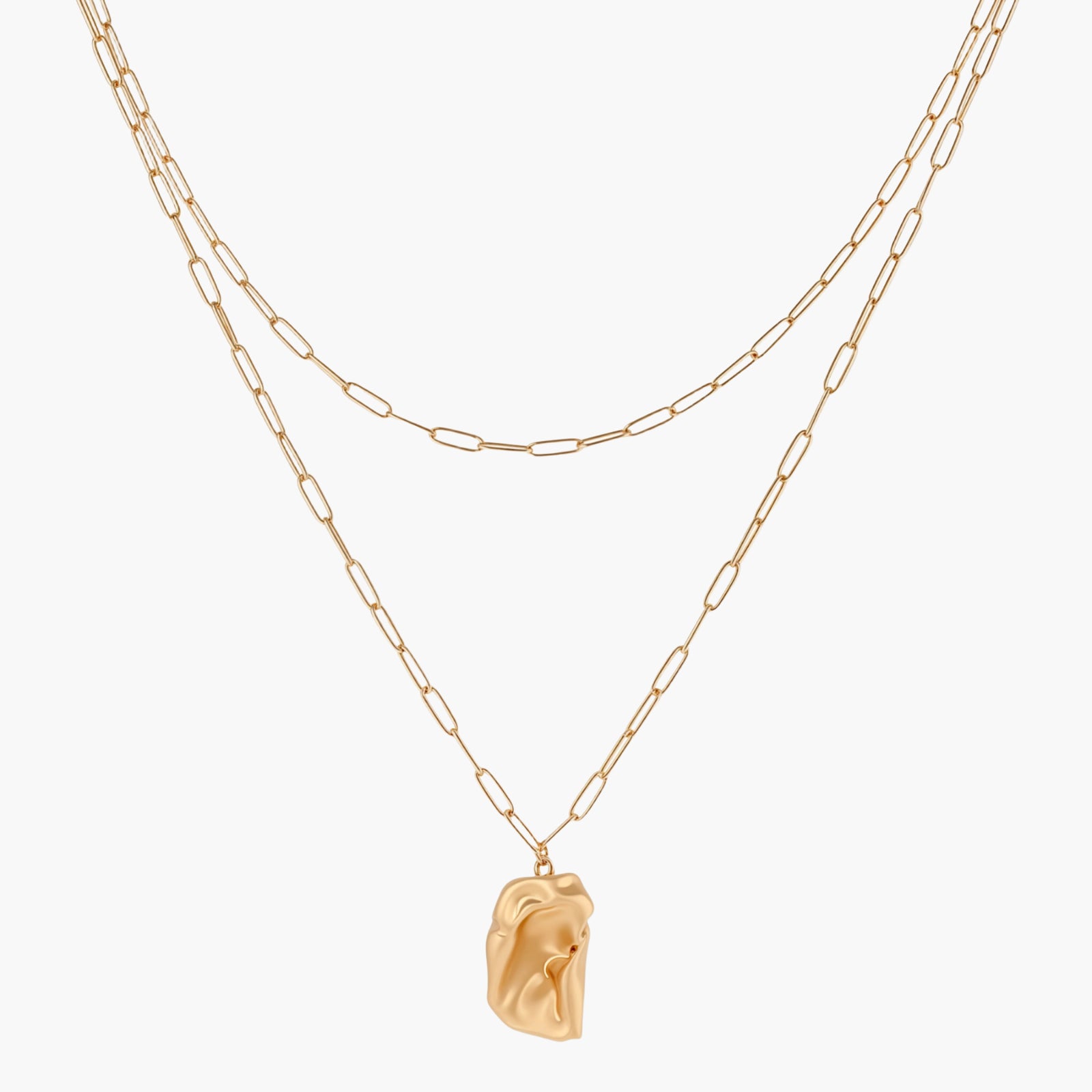 Layered paperclip chain necklace with organic flowing pendant made from eco-zinc alloy in warm gold finish