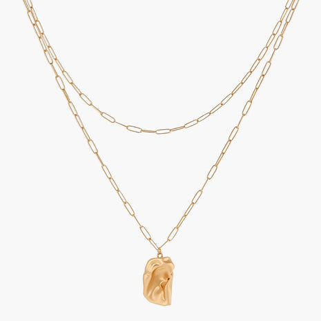 Layered paperclip chain necklace with organic flowing pendant made from eco-zinc alloy in warm gold finish