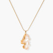 Close-up of a sculptural necklace with flowing wave pendant made from eco-zinc alloy on adjustable chain