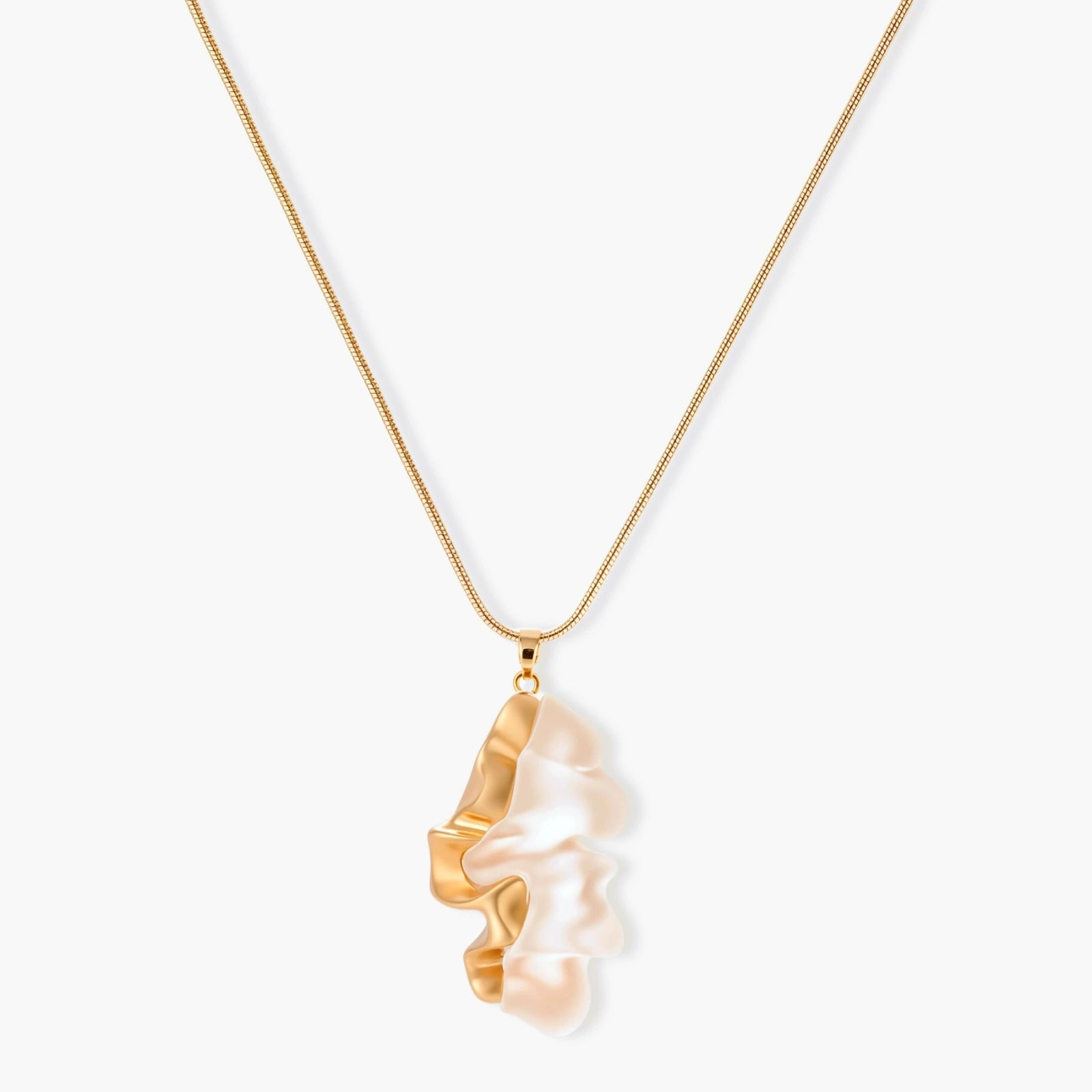 Close-up of a sculptural necklace with flowing wave pendant made from eco-zinc alloy on adjustable chain