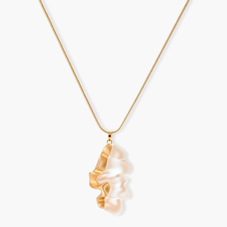 Close-up of a sculptural necklace with flowing wave pendant made from eco-zinc alloy on adjustable chain