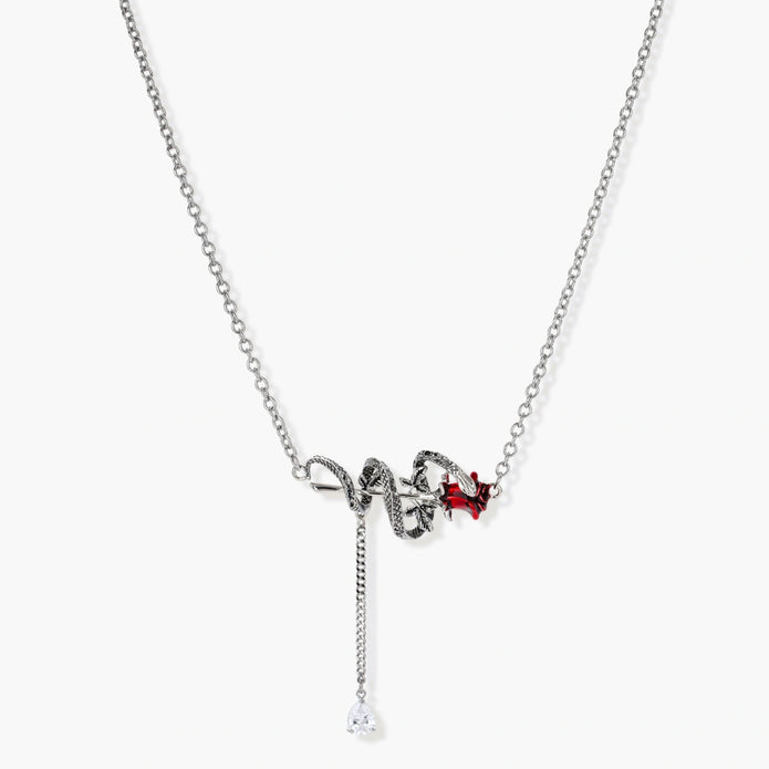 Detailed eco-brass serpent pendant necklace with red zirconia stone and crystal drop tassel on adjustable chain