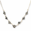 Adjustable cream cord necklace with white spotted stone beads featuring black speckles on neutral background