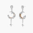 Detailed eco-brass dangle earrings featuring crescent moons with gold rope details and dangling star charms on white background.