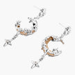 Detailed eco-brass dangle earrings featuring crescent moons with gold rope details and dangling star charms on white background.