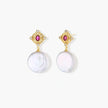 Gold baroque pearl earrings with pink gemstone studs and ornate detailing on cream background.