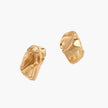 Abstract crumpled metallic earrings with fluid organic shapes in reflective gold and silver finish on neutral background.