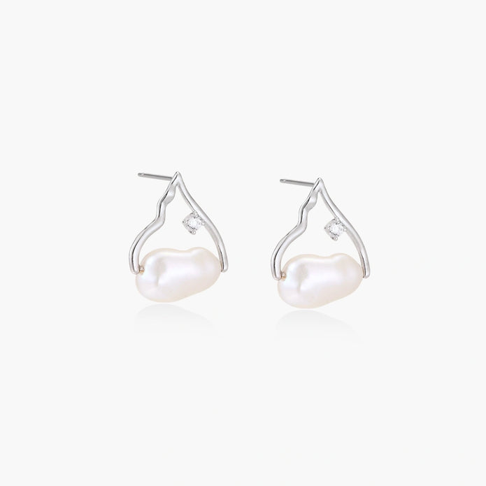 Silver mountain outline studs with baroque pearl and diamond accent on white background