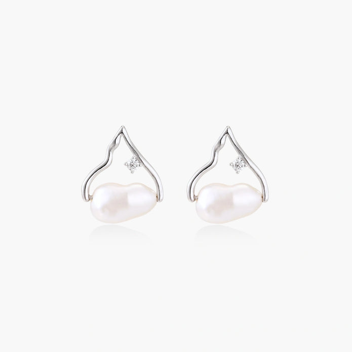 Silver mountain outline studs with baroque pearl and diamond accent on white background