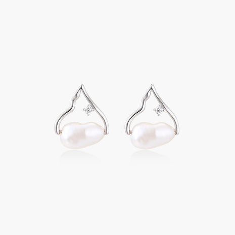 Silver mountain outline studs with baroque pearl and diamond accent on white background