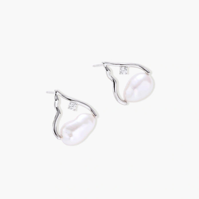 Silver mountain outline studs with baroque pearl and diamond accent on white background