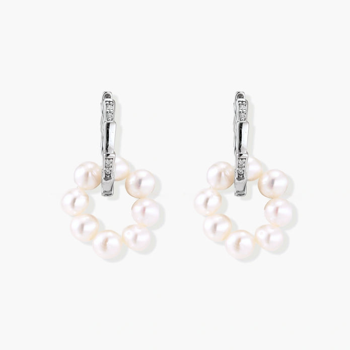 Rhodium-plated silver hoop earrings with freshwater pearls arranged in crescent formation and diamond accents