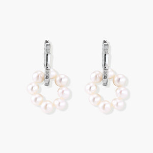 Rhodium-plated silver hoop earrings with freshwater pearls arranged in crescent formation and diamond accents