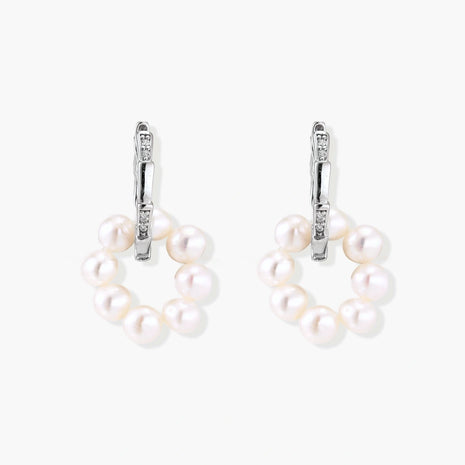 Rhodium-plated silver hoop earrings with freshwater pearls arranged in crescent formation and diamond accents