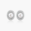 Elegant stud earrings with cream freshwater pearls surrounded by sparkly pavé crystals on rhodium-plated silver setting
